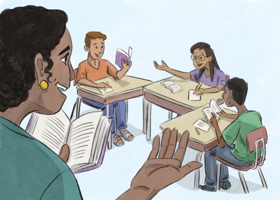 Teacher holding book standing with students at desk following along the book and taking notes