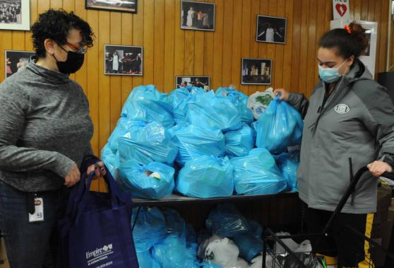 two women collect clothes