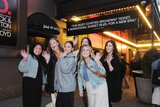 Teachers from JHS 185 in Queens are all smiles as they gather for a performance of "Sunset Blvd." with fellow UFT members.
