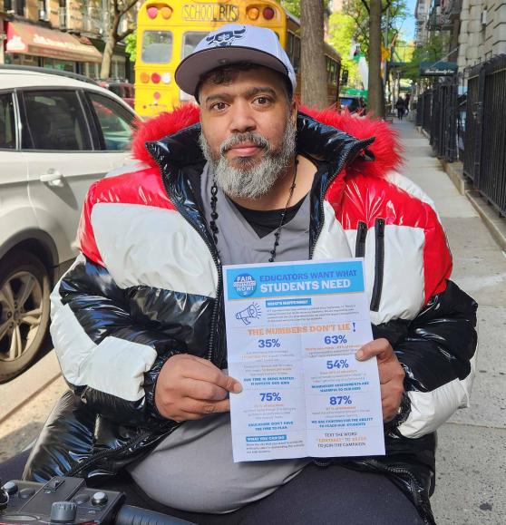 Man hands out flyers