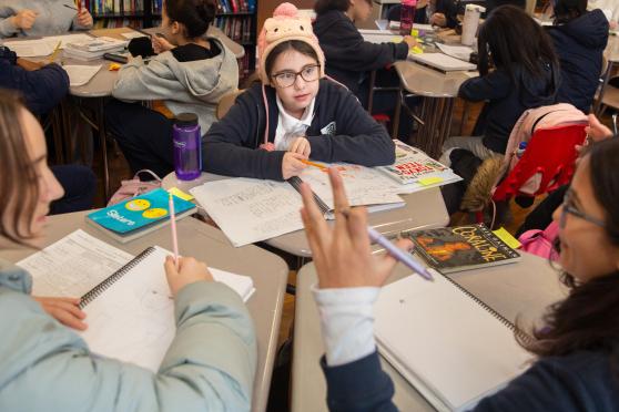 Sixth-graders work on writing and illustrating comics in an intensive co-taught by ENL teacher Silvia Smythe at the Young Women's School of Astoria.