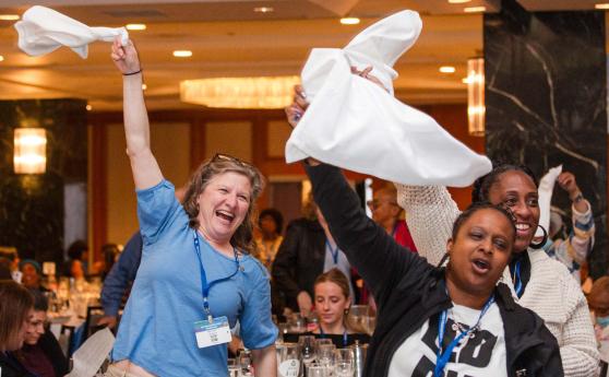 UFT members cheer the speakers at the union’s annual spring gathering of educators.