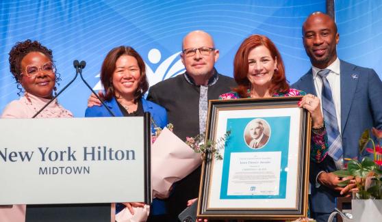 Standing with Win CEO Christine Quinn (fourth from left) as she accepts the John Dewey Award, the union’s most prestigious honor for a nonunion member, are (from left) UFT Vice President Janella Hinds, UFT Treasurer Victoria Lee, UFT President Michael Mulgrew and Schools Chancellor Kamar Samuels.