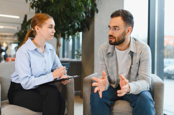 A generic image of a patient and counselor during a session.