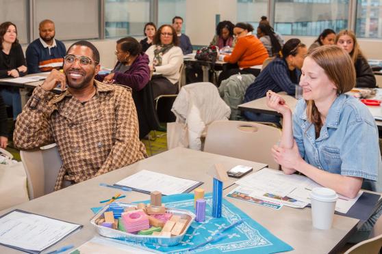 Participating in the “Where Play Meets the Science of Reading” workshop are teachers Kyle Jackson of PS 28 in the Bronx and Melissa Noble of the District 2 Pre-K Center in Manhattan.