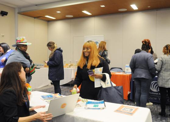 School counselors gather information in the exhibit hall at UFT headquarters during the union’s 21st annual School Counselors Conference.