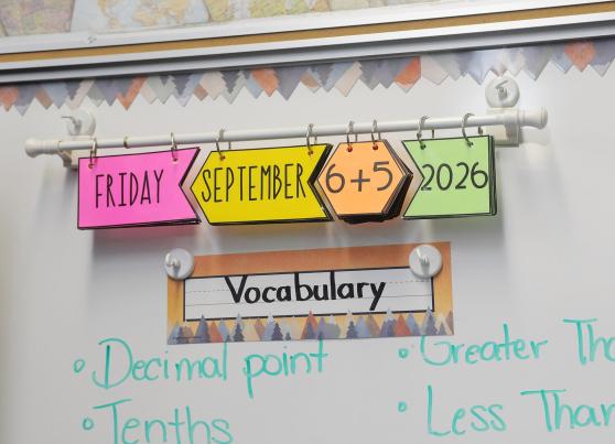 Una-Belinda Titus, 4th grade math teacher at PS 284 in Brooklyn has her students solve a basic math problem to figure out and write the day's date in their notebooks. 