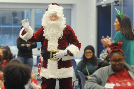 Santa Claus arrives to a kazoo-driven rendition of “Jingle Bells" at the UFT/Coalition for the Homeless holiday toy drive and celebration on Dec. 7, 2024. 
