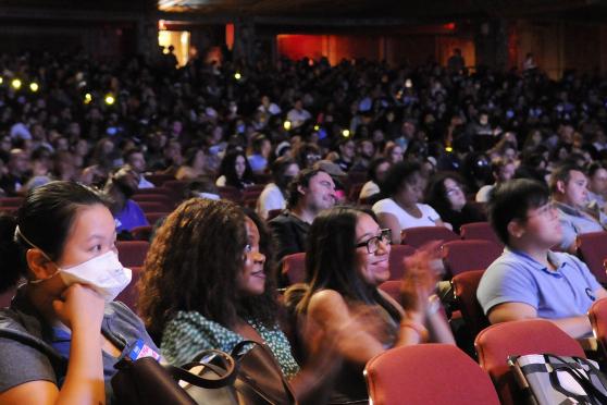 A crowd of members in a theatre 