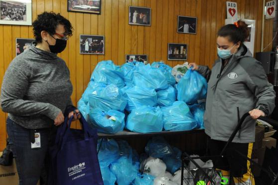 two women collect clothes