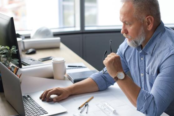 Generic man working on a laptop