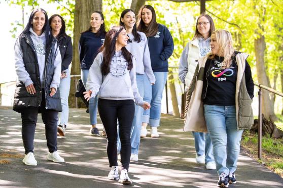 (Front row, from left) Teachers Janine Treglia and Jen Fabrizio lead colleagues on a lunchtime walk.