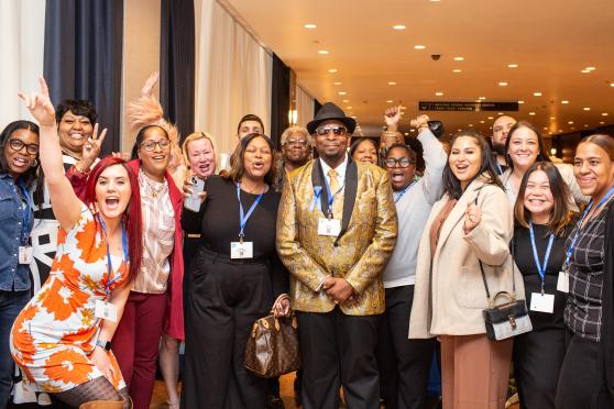 Stephen Bradshaw, one of this year’s Humanitarian Award recipients and a paraprofessional at MS 217 in Queens, is celebrated by all the paraprofessionals at his school at the 2025 UFT Paraprofessionals Awards Luncheon on March 22, 2025. 
