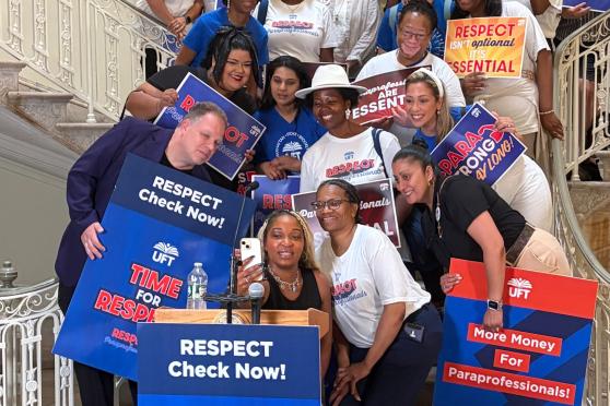 Paraprofessionals take a selfie at City Hall 