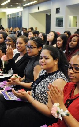 Awaiting their turn on stage, winners listen to guest speakers.