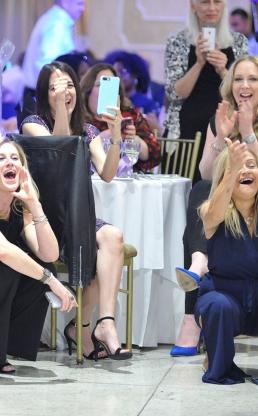 Members from PS 106 vie for the award as the best cheering section.