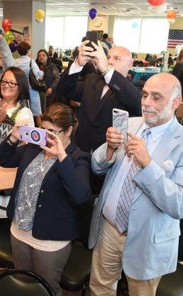 Guests snap photos of their loved ones who were recognized.