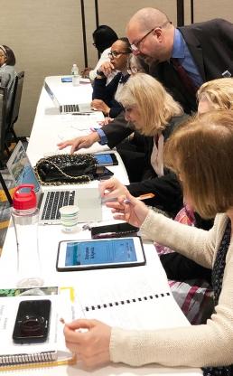 Educators get hands-on learning in the workshop on instructional technology.