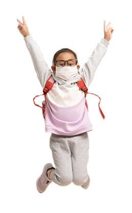 Masked male child with glasses jumping in the air - Generic