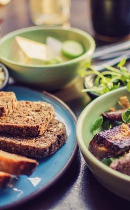 A plate of bread, veggies, cheese