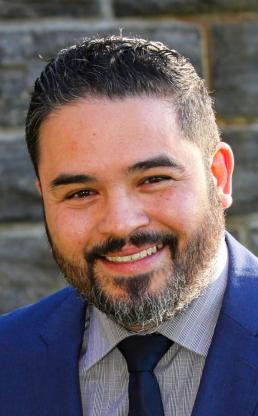 Portrait of a bearded brunette man smiling