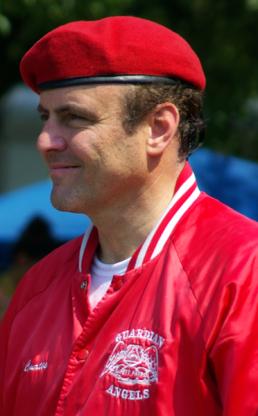 Side profile of a man with red beret