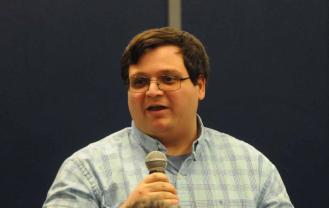 Man speaks using a microphone