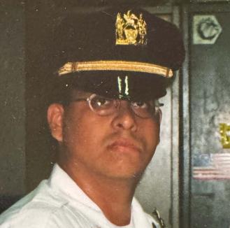 Seth Gilman, as a young police officer in 2001.