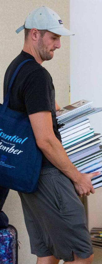 A teacher hauls away free books